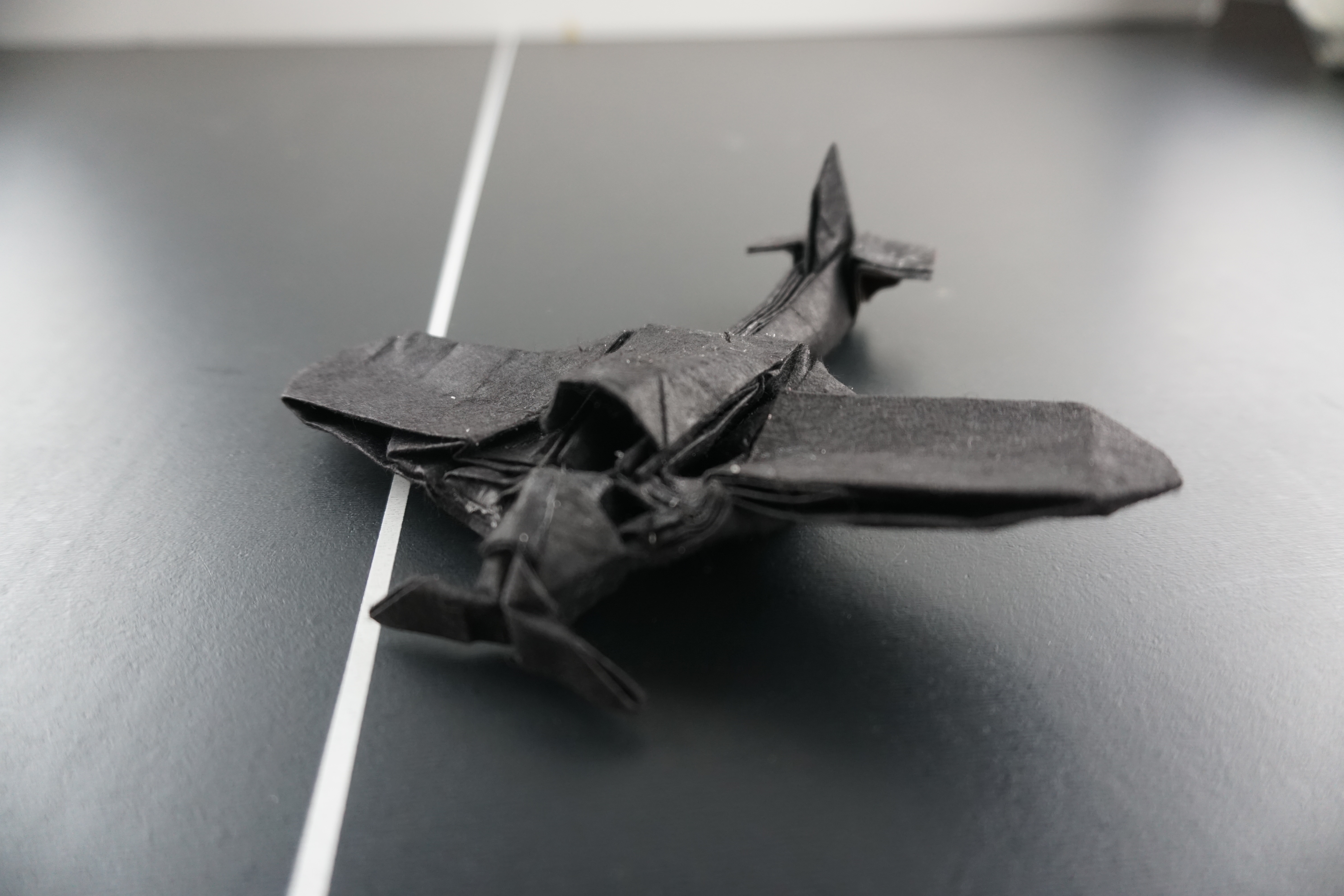 Black origami airplane